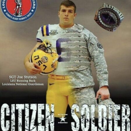 cropped-LSU.jpeg A football player in uniform is standing on the field.